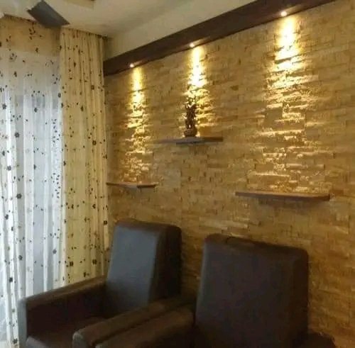 Living Room Gold Ledgestone Accent Wall